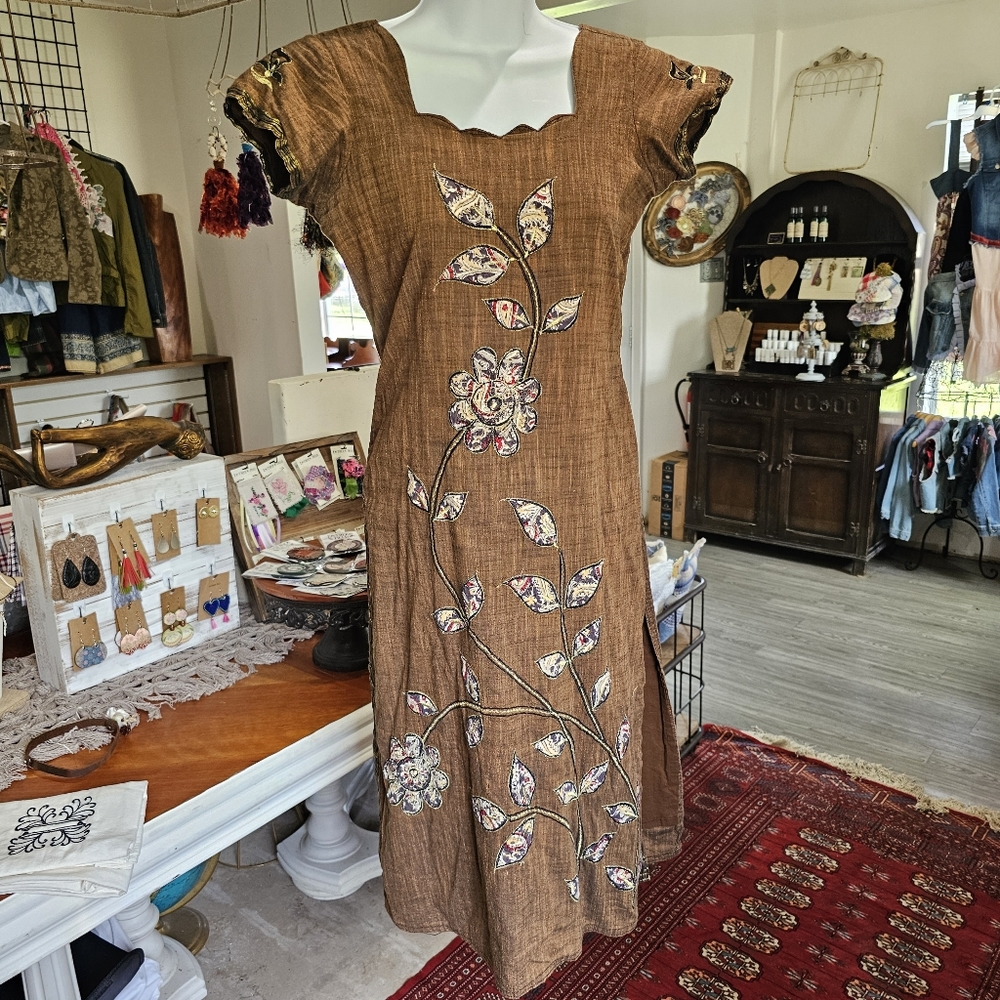 Brown embroidered and appliqued tunic top with slit sides for easy walking